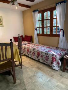 Postel nebo postele na pokoji v ubytování Complejo Villa General Belgrano + 2 fotografie