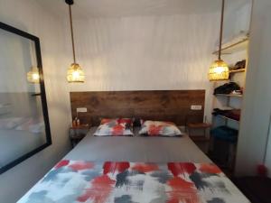 a bedroom with a bed with two pillows on it at DarAlRayhan in Aïn Draham