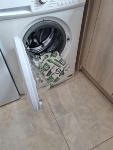 a washing machine with its door open in a kitchen at Apartmán Horný Smokovec in Smokovce +52 photos