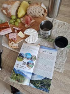 a table with a bunch of different types of bread at Apartmán Horný Smokovec in Smokovce
