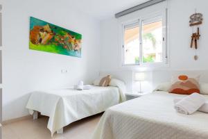 En eller flere senge i et værelse på El Rinconcito de Vera Playa-Almería + 33 billeder