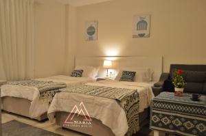 Letto o letti in una camera di Maria Pyramids House
