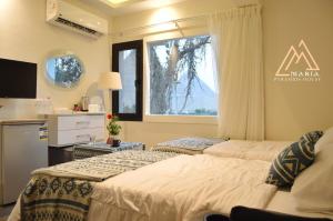 Letto o letti in una camera di Maria Pyramids House