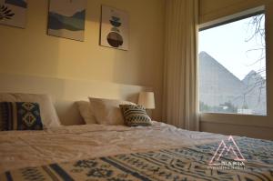Letto o letti in una camera di Maria Pyramids House