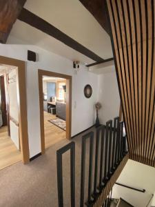 a living room with a staircase and a living room with a stairwayexitangering at Ferienhaus Auszeit in Bad Kreuznach +36 photos