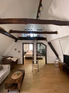 a room with a loft bed in a attic at Ferienhaus Auszeit in Bad Kreuznach
