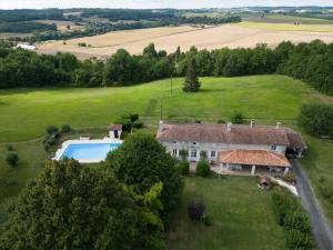 an aerial view of a house with a swimming pool at Le Boisdalon in Yviers