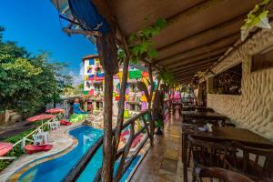 a resort with a swimming pool and a restaurant at Pousada das Galinhas in Porto De Galinhas +40 photos