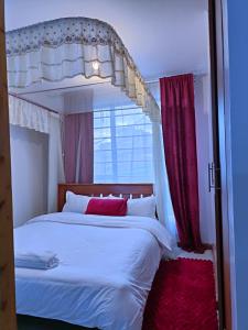 Postel nebo postele na pokoji v ubytování Baibai Homes Rm 204 &114