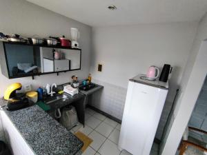 Ảnh trong thư viện ảnh của Ed Bertholi - Vista lateral do mar com garagem ở Serra