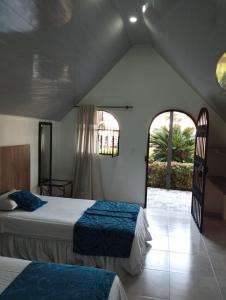 Una cama o camas en una habitación de Hotel Las Victorias Palmira 37 fotos más