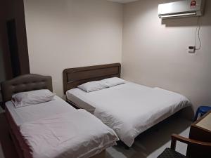 Voodi või voodid majutusasutuse Hotel Kavanass Inn toas