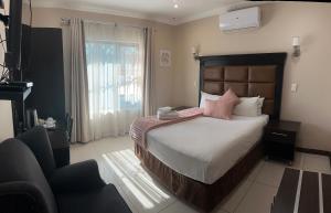 Postel nebo postele na pokoji v ubytování Aqua Stone guest house