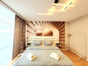 Ένα ή περισσότερα κρεβάτια σε δωμάτιο στο 2- Zimmer, 4Pers, direkt neben Einkaufszentrum, Hbf