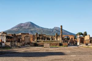 an ancientropolis with a mountain in the background at Domus Selene Pompei in Pompei