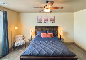 a bedroom with a bed and a ceiling fan at Fun & Peaceful Family Retreat in Flagstaff