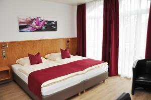 Postel nebo postele na pokoji v ubytování Garni Hotel Alber