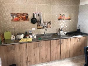 a kitchen with a sink and a counter top at habitacion amoblada in Sonsón