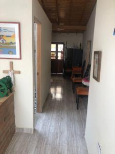 a hallway with a living room and a dining room at habitacion amoblada in Sonsón