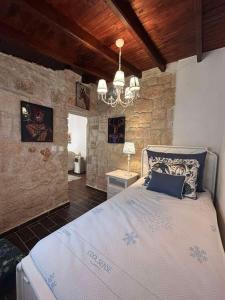 Postel nebo postele na pokoji v ubytování STONE Villa