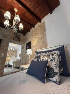 Postel nebo postele na pokoji v ubytování STONE Villa