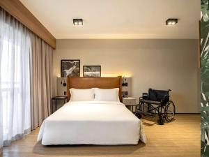 Cama ou camas em um quarto em Grand Mercure SP Itaim Bibi
