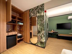 A cozinha ou cozinha compacta de Grand Mercure SP Itaim Bibi