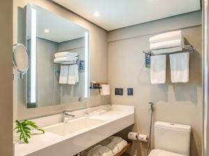 Um banheiro em Grand Mercure SP Itaim Bibi