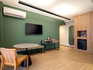 A cozinha ou cozinha compacta de Grand Mercure SP Itaim Bibi