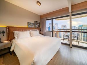 Cama ou camas em um quarto em Grand Mercure SP Itaim Bibi