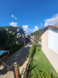 a view of a street with a building and a sign at Nativus Flats in Itacaré +14 photos