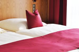 Postel nebo postele na pokoji v ubytování Garni Hotel Alber