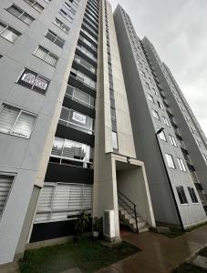 a tall building with a stairway in front of it at Excelente ubicación como en casa tranquilidad in Villamaría