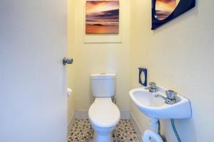 a bathroom with a toilet and a sink at Luskin Lodge 11 stunning water views in Shoal Bay +14 photos