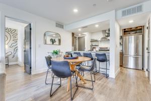 a kitchen and dining room with a table and chairs at Patio and Dillon Reservoir Views Chic Frisco Condo! in Frisco