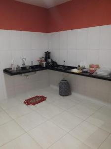 Kuchyň nebo kuchyňský kout v ubytování Casa de Temporada