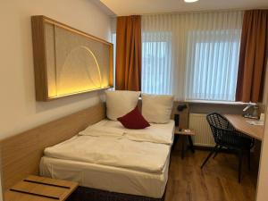 Postel nebo postele na pokoji v ubytování Hotel Kübler