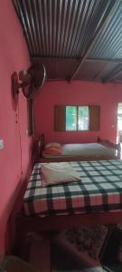 Postel nebo postele na pokoji v ubytování Hostel María Ometepe