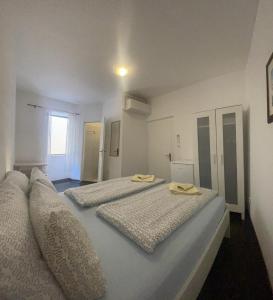 Postel nebo postele na pokoji v ubytování Boutique House Djak