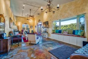 a living room with a couch and a window at Soul Whispering Ranch Retreat in Upper Lake