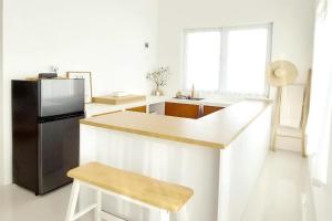 Η κουζίνα ή μικρή κουζίνα στο Floraison Living Villa