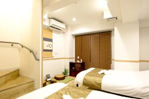 Postel nebo postele na pokoji v ubytování 東京新橋579 Shinbashi Residence