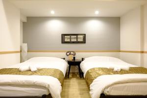 Postel nebo postele na pokoji v ubytování 東京新橋579 Shinbashi Residence