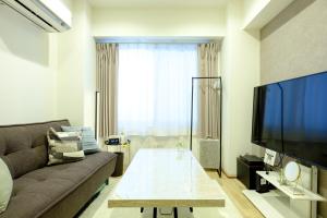 TV a/nebo společenská místnost v ubytování 東京新橋579 Shinbashi Residence