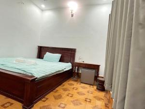 Postel nebo postele na pokoji v ubytování Takeo Guesthouse