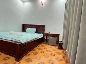 Postel nebo postele na pokoji v ubytování Takeo Guesthouse