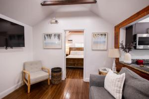 a living room with a couch and a chair at The Caroline Suite in Key West