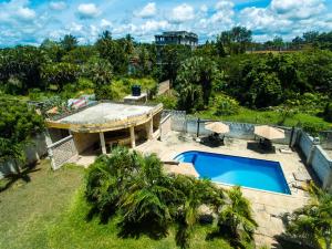 an aerial view of a house with a swimming pool at Wendy's Penthouse Diani in Ukunda