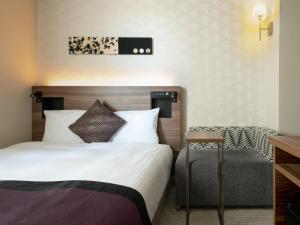 Postel nebo postele na pokoji v ubytování Hotel Vista Nagoya Nishiki