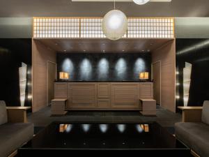 a lobby with a large screen in a building at Hotel Vista Nagoya Nishiki in Nagoya